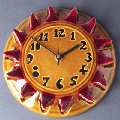 Nap formájú kerámia falióra